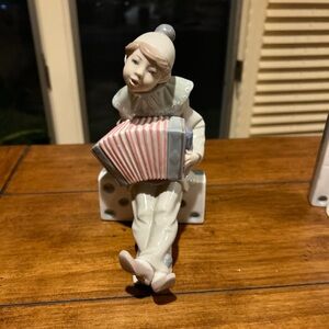 Lladro Retired Figurine boy on domino with Accordion